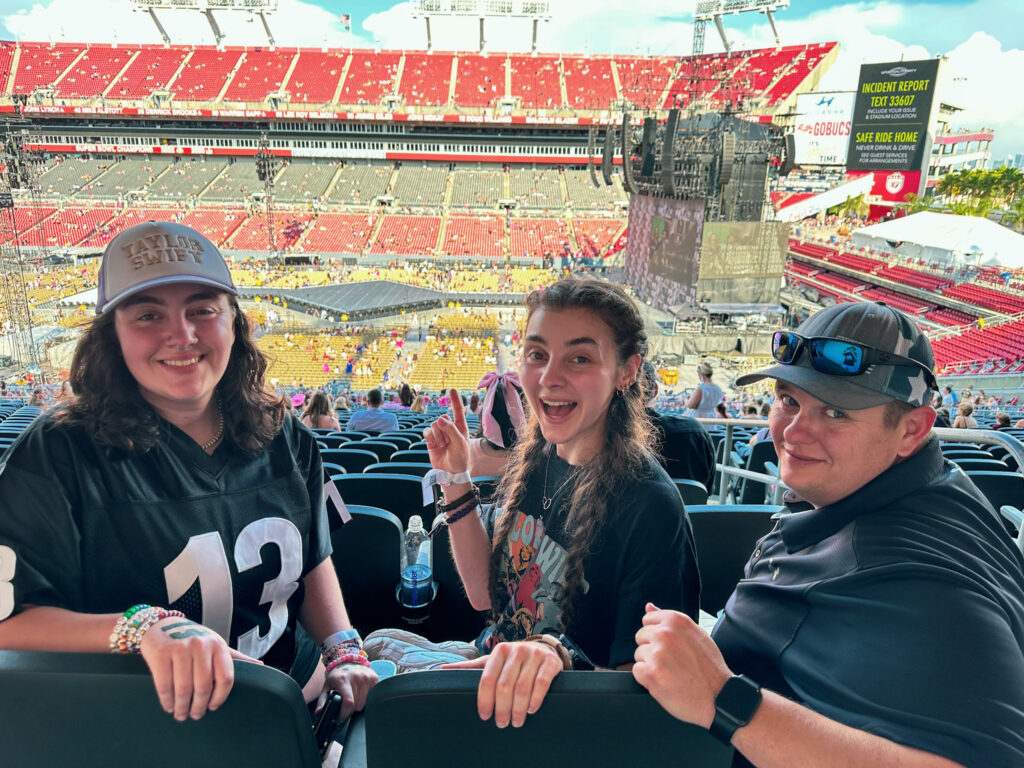 Anna, Lisa and their brother Peter sitting in their seats before the Taylor Swift concert started.