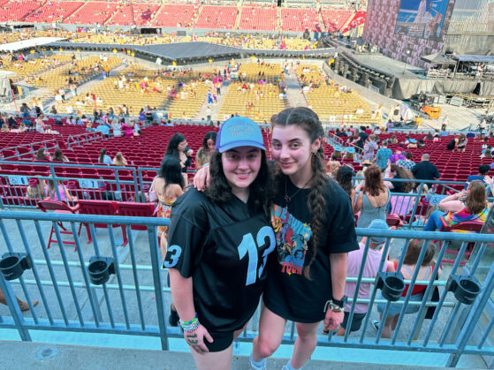 Lisa and Anna at Raymond James Stadium in front of Taylor Swift's stage.