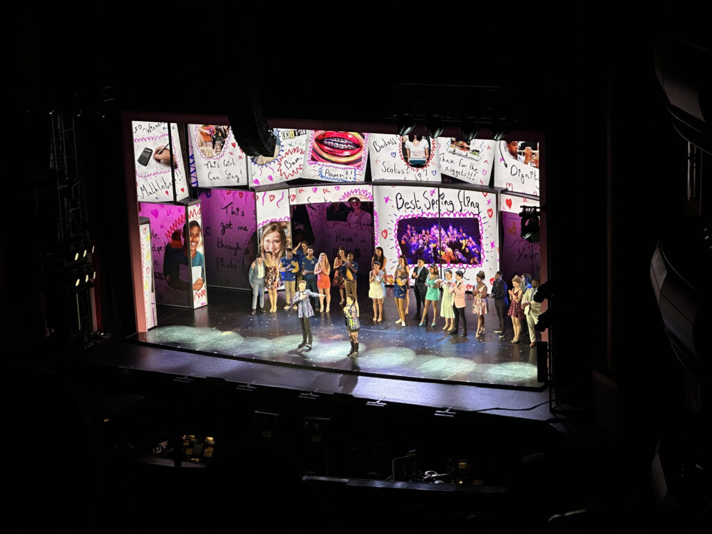The Mean Girls the Musical cast on the stage, bowing at the end of the show.