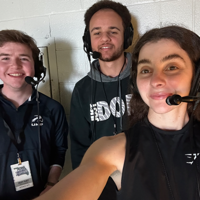 Riley and Winston play-by-play basketball broadcast with Lisa operating sound.